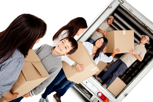 Man and van removal team preparing boxes for a local move