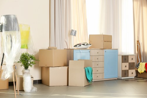 Packed moving boxes and household items ready for a domestic removal service