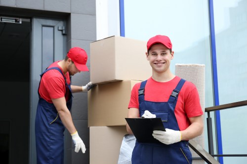 Commercial movers preparing office items for a local business relocation