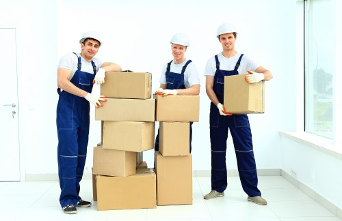 Local removal team carrying furniture from a residential property
