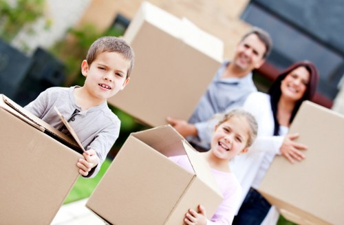 Professional movers unloading items at a property in Removalservices