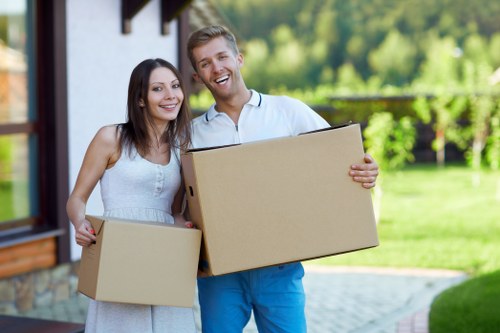 Professional movers handling a flat relocation with stairs and access planning
