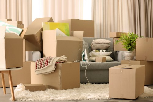 Furniture and household items ready for collection by a removal van