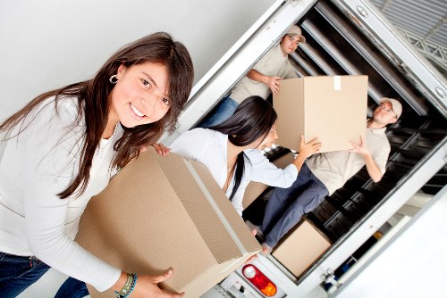 Loading household furniture into a moving van in Removalservices