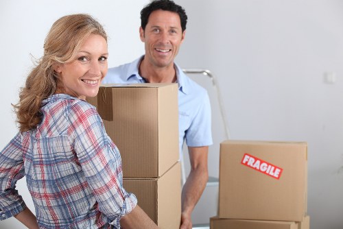Business relocation scene with office furniture and cartons prepared for moving
