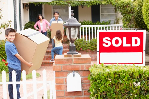 Removal crew loading furniture carefully from a home in Removalservices
